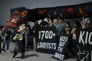 Activists protesting against fossil fuel lobbyists participating in the COP29.jpg