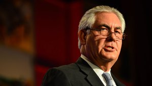 REX W. TILLERSON, Chairman, President and CEO of Exxon Mobil Corporation