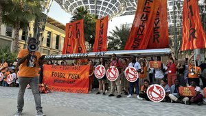 Fossil fuel phase-out protest outside of the Brazil pavilion at COP28.jpg