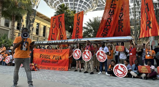 Fossil fuel phase-out protest outside of the Brazil pavilion at COP28.jpg