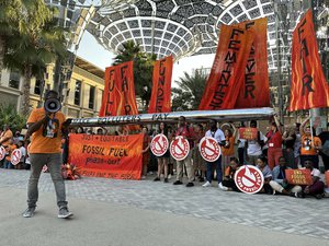 Fossil fuel phase-out protest outside of the Brazil pavilion at COP28.jpg