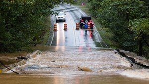 Waxhaw, North Carolina - September 16, 2018: Motorists inspect a road flooded by rain from Hurricane Florence Credit: Jeremy Warner/ Shutterstock