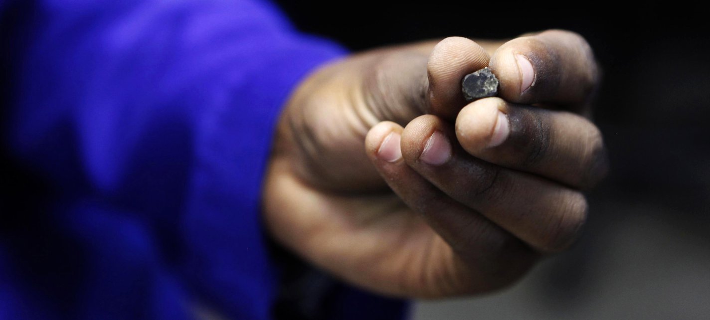 Marange rough diamond in hand