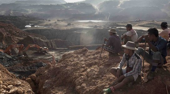 Freelance Yemasae miners sit on top of a hill near the Ngo Pin