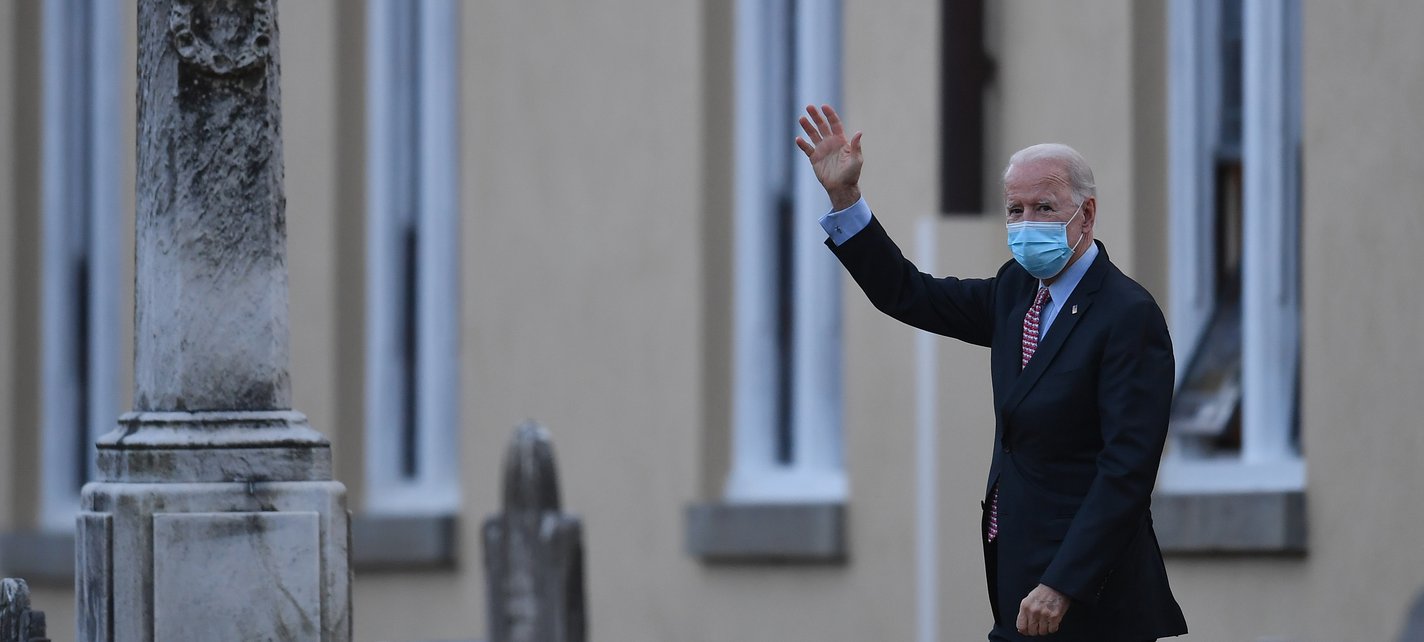 US President-elect Joe Biden waves as he leaves St. Joseph-ANGELA WEISSAFP via Getty Images.jpg