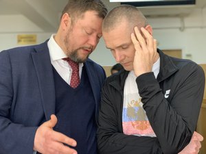 Lawyer Timofey Musatov advises his client, Alexander Vinnik